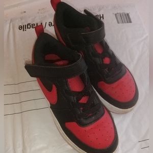 Red black and white Nike